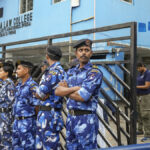 West Bengal police transport Manojit Mishra, a major suspect in the rape of a Kolkata law student, to South Kolkata Law College and reconstruct the crime scene.