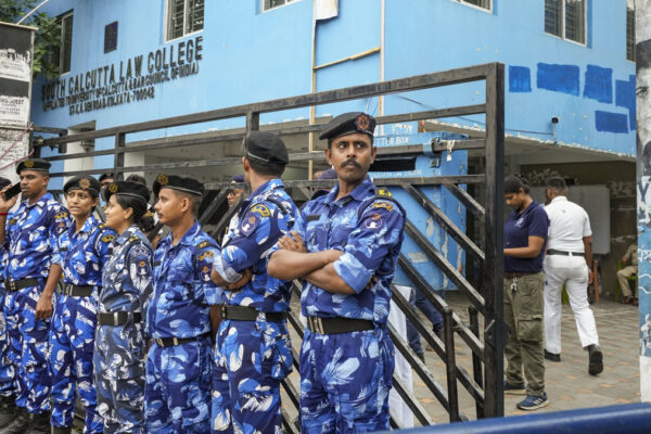 West Bengal police transport Manojit Mishra, a major suspect in the rape of a Kolkata law student, to South Kolkata Law College and reconstruct the crime scene.