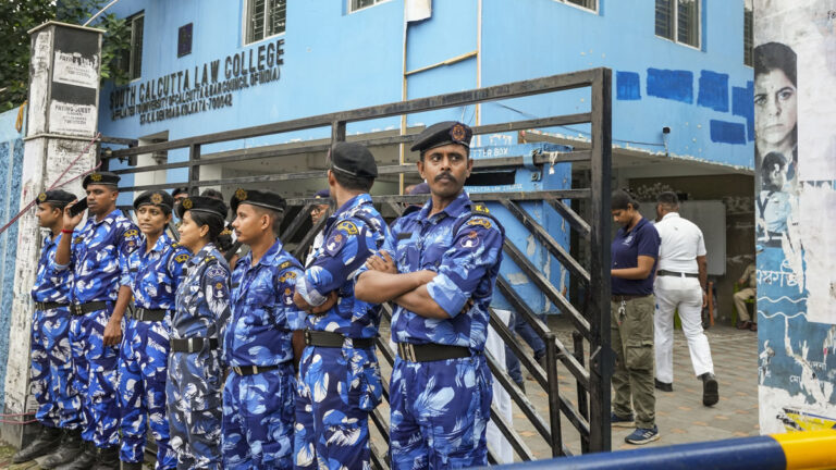 West Bengal police transport Manojit Mishra, a major suspect in the rape of a Kolkata law student, to South Kolkata Law College and reconstruct the crime scene.